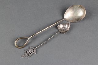 A silver preserve spoon and a souvenir spoon 