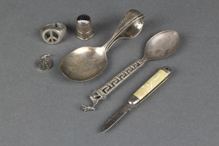 A childs silver pusher spoon and minor items