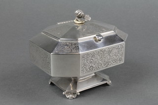 A Dutch silver octagonal waisted tea caddy with floral finial and scroll feet approx. 130 grams