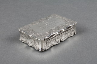 A Victorian silver table top snuff box with chased scroll decoration and presentation inscription, Birmingham 1897, approx 142 grams