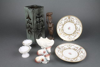A Glee Pottery square Chinese style vase 9" (cracked), 2 Rosenthal porcelain plates with gilt banding and floral decoration 6 1/2", a pair of Staffordshire style figures of seated cows 3", a Coalport shell shaped vase 4", a pair of Victorian circular scallop pressed glass salts 2" and an African carved wooden figure of a standing lady 8" 