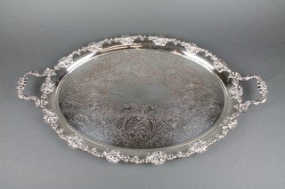 A silver plated 2 handled oval tray with vinous border 
