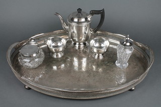 A silver plated 3 piece tea set, a patent sugar bowl, shaker and galleried tray 