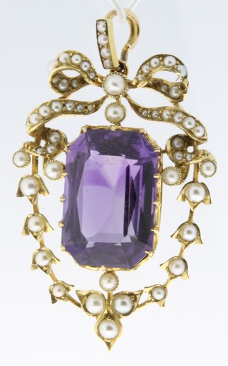 An Edwardian high carat seed pearl and amethyst pendant 