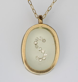 A 9ct gold pendant on a ditto chain 