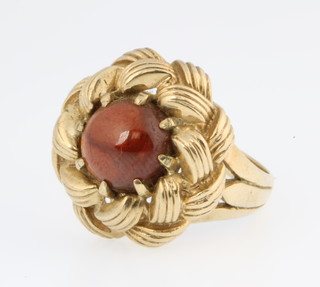 A 9ct gold dress ring set with a cabouchon cut garnet, size M