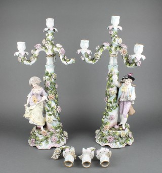 A pair of early 20th Century German candelabra with figural and floral encrusted bases and 4 lights 21" 