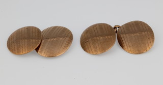 A pair of 9ct gold engine turned cufflinks approx. 6 grams