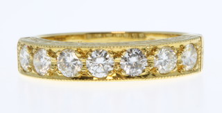 An 18ct yellow gold 7 stone diamond ring, approx 1ct, size O 1/2