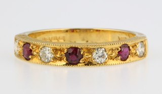 An 18ct white gold ruby and diamond ring, size O 1/2