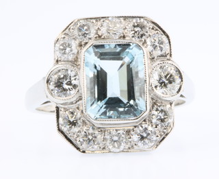 An 18ct white gold aquamarine and diamond cluster ring, the centre stone approx. 2 ct surrounded by diamonds approx 1.35ct, size Q