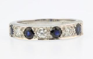 An 18ct white gold diamond and sapphire half eternity ring, size M 1/2