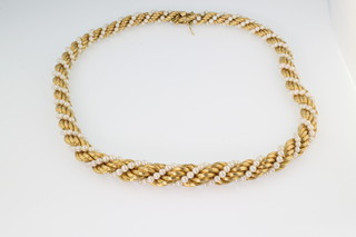 An 18ct yellow gold and seed pearl twist necklace, gross 50 grams, 16 1/2" 