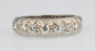 An 18ct white gold 7 stone diamond ring, size M 