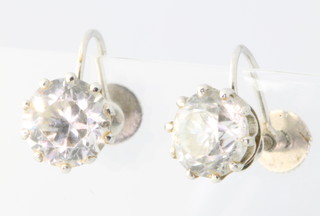 A pair of 9ct white gold paste set ear clips