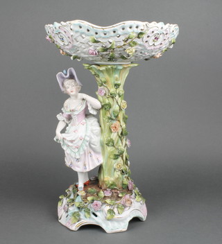 An early 20th Century German centre piece, the rococo base with a standing lady and a pierced bowl supported on a flower encrusted stem 15" 