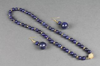 A contemporary faceted lapis lazuli necklace and drop earrings