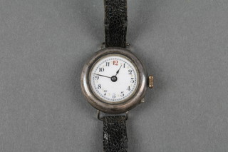 A lady's silver cased wristwatch with enamelled dial and red 12 