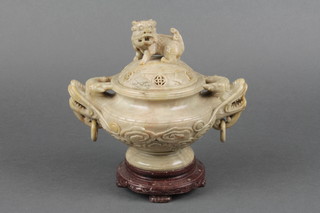 A carved soapstone censer and cover with shi shi finial and lion ring handles on a soapstone base 8" 