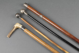 3 silver mounted walking canes and 2 riding crops