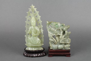 A carved jadeite figure of a deity on wooden base 8", a ditto of a duck beneath a tree 6" 