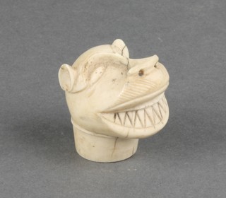 An early 19th Century naive carved ivory walking cane handle in the form of a leopard