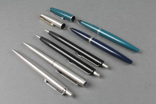 A Parker turquoise coloured fountain pen, 1 other and 3 ball pens
