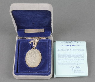 A 1977 silver commemorative pendant and chain 