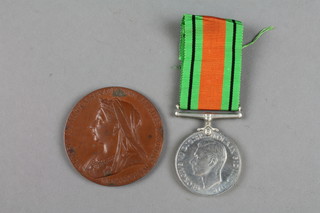 A Queen Victoria Jubilee commemorative medal in bronze, a defence medal
