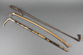 An Edwardian silver and stag horn hunting whip by Howell of London, bamboo shaft (f) Birmingham 1905, 1 other bamboo silver and horn mounted hunting whip and a riding crop 