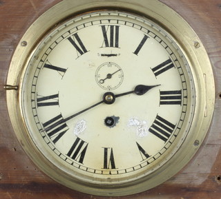 A Ward Room style clock, the 8" painted dial with Roman numerals and minute indicator, contained in a lockable brass case complete with key  