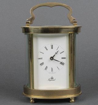 Fema, 20th Century oval carriage timepiece with enamelled dial and Roman numerals marked Imperial, contained in a gilt metal case 