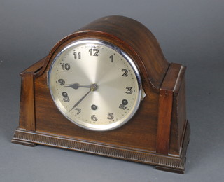 A 1930's chiming mantel clock with silvered dial and Arabic numerals contained in a Monet arch shaped case 
