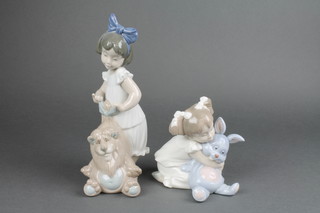 A Nao group of a young girl with a rabbit 4", a ditto of a young girl with bear 8", boxed 
