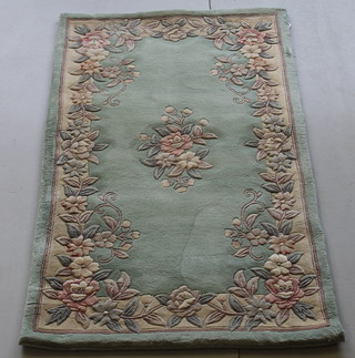 A green ground and floral patterned Chinese rug 59" x 36" 