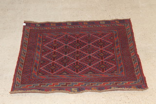 A red and blue ground Meshwani rug with diamonds to the centre 46" x 44 1/2" 