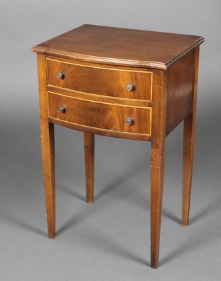 A Georgian style mahogany bow front bedside table, inlaid satinwood stringing and raised on tapered supports 26"h x 17"w x 13 1/2"d 