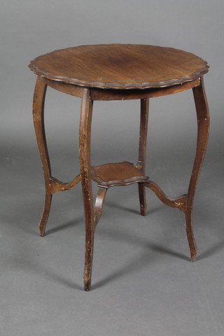 An Edwardian circular mahogany 2 tier occasional table with pie crust edge, raised on cabriole supports 20"h x 24"diam. 