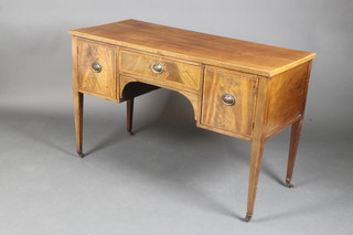 A 19th Century mahogany sideboard fitted 1 long drawer flanked by a pair of cupboards, raised on square tapering supports ending in brass caps and castors 30"h x 47 1/2"w x 21"d 