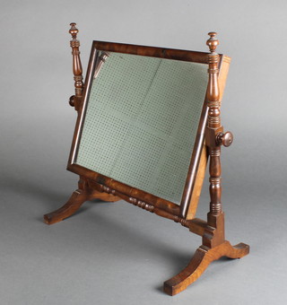 A Georgian rectangular plate dressing table mirror contained in a turned mahogany swing frame 20"h x 18"w