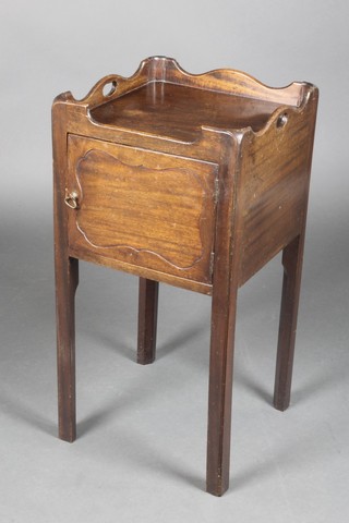 A Georgian style mahogany tray top bedside cabinet enclosed by a panelled door, raised on square supports 29"h x 40 1/2"w 