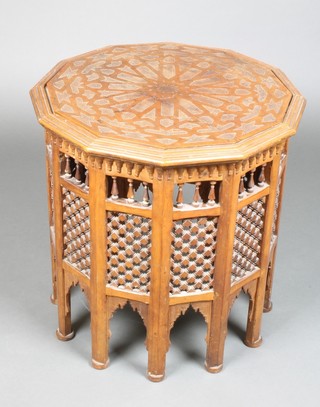 A Moorish style carved hardwood 12 sided occasional table with spindle turned and pierced decoration 21"h x 20" diam. 