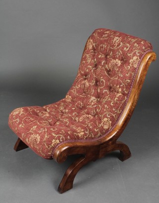 A Victorian mahogany show frame nursing chair upholstered in button back material