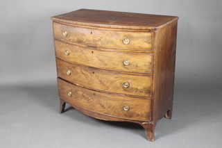 A 19th Century mahogany bow front chest of 4 long drawers with brass ring drop handles, raised on splayed bracket feet 36"h x 38 1/2"w x 21"d 