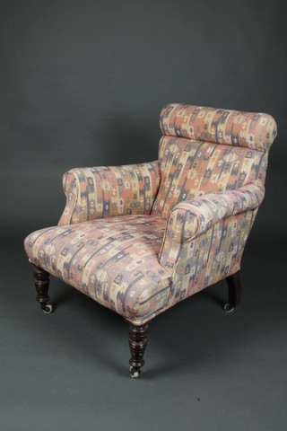 An Edwardian mahogany armchair upholstered in pink Kilim style material 