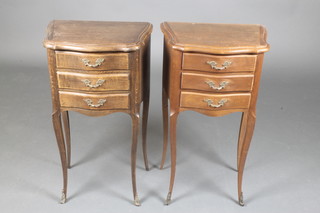 A pair of French oak bedside chests of serpentine outline fitted 3 drawers, raised on cabriole supports with gilt metal mounts 29"h x 16 1/2"w x 11"d 