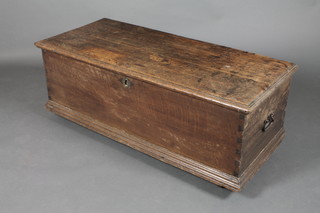 An 18th/19th Century elm coffer with hinged lid, brass escutcheon, iron lock and drop handles to the sides 19"h x 50 1/2"w x 21 1/2"d 