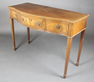 A Georgian style mahogany side table of serpentine outline with crossbanded top and satinwood stringing, fitted 1 long and 2 short drawers, raised on square tapering supports, spade feet 34"h x 48"w x 21 1/2"d 