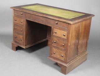 A Victorian mahogany kneehole pedestal desk with inset writing surface, fitted 1 long drawer and various compartments above 6 short drawers with tore handles 30"h x 46"w x 26"d 