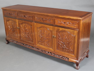 A Chinese carved Padouk sideboard fitted 4 drawers above 4 cupboards with pierced and carved apron, raised on cabriole supports 34"h x 72"w x 19"d 